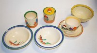 Lot 230 - A collection of Clarice Cliff pottery effects,...