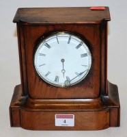 Lot 4 - A late 19th century walnut cased mantel clock...