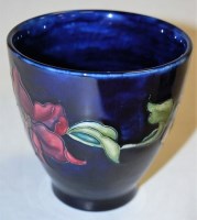 Lot 233 - A Moorcroft blue ground vase, decorated with...