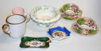 Lot 236 - A pair of Rockingham type porcelain teacups...
