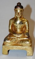 Lot 280 - A gilt bronze figure of an Eastern deity in...