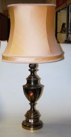 Lot 12 - A large lacquered brass table lamp of urn...