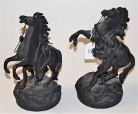 Lot 54 - A pair of modern spelter figures of rearing...