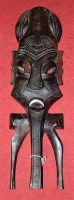 Lot 128 - A 20th century carved hardwood tribal mask,...
