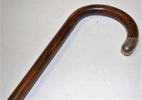 Lot 143 - A circa 1900 faux rosewood walking cane having...