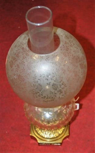 Lot 183 - A late Victorian oil lamp having globular...