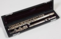 Lot 504 - A cased silver-plated three piece flute, by...