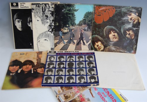 Lot 603 - Seven LP vinyl records by The Beatles, to...