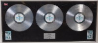Lot 616 - A framed set of three silver vinyl, Lionel...