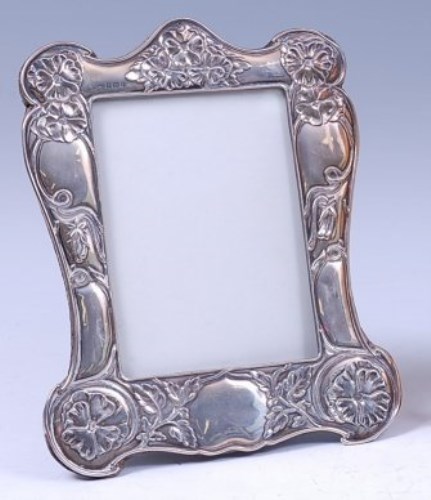 Lot 130 - An Art Nouveau silver easel photograph frame,...
