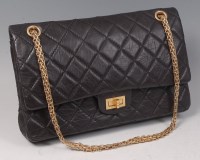 Lot 166 - A Chanel 2.55 quilted black leather Jersey bag,...