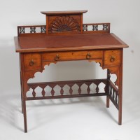 Lot 305 - Liberty & Co - An Arts & Crafts walnut...