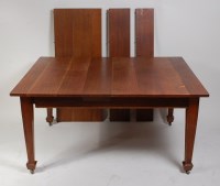 Lot 308 - An Arts & Crafts oak extending dining table,...