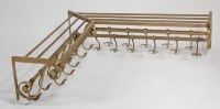 Lot 314 - A large 1920s brass corner coat-rack, having...