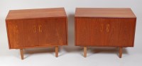 Lot 334 - A pair of 1960s G-Plan teak low double door...