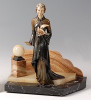 Lot 190 - An Art Deco patinated spelter model of a robed...