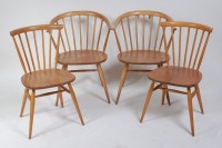 Lot 366 - A pair of Ercol blond elm stickback tub elbow...