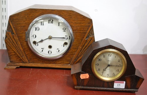 Lot 15 - An Art Deco oak cased mantel clock, having...