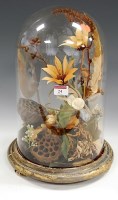 Lot 24 - A Victorian arrangement of dried flowers under...