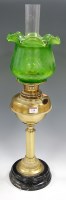 Lot 110 - An early 20th century brass oil lamp, having...