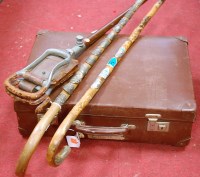 Lot 142 - Two walking sticks, each with applied pressed...