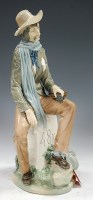 Lot 162 - A large Lladro porcelain figure of a peasant...