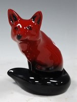 Lot 172 - A Royal Doulton flambé figure of a seated fox,...