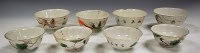 Lot 183 - A set of four Chinese porcelain tea bowls,...