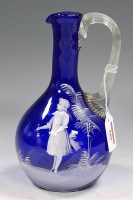 Lot 189 - A Victorian Mary Gregory blue glass decanter,...