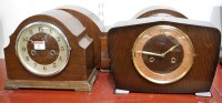 Lot 8 - An Art Deco walnut cased mantel clock, the...