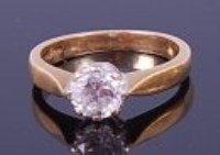 Lot 1275 - A modern 18ct gold diamond solitaire ring, the...