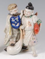 Lot 1398 - A Japanese late Meiji period stoneware figure...