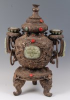 Lot 1412 - A Tibetan white metal and hardstone set temple...