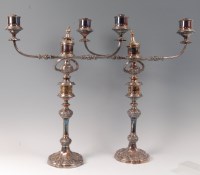 Lot 1208 - A pair of silver plated three light candelabra,...