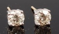 Lot 1234 - A pair of 18ct gold and diamond ear studs, the...