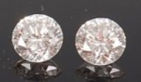 Lot 1235 - A pair of loose brilliant cut diamonds, each...