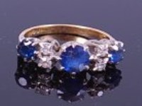 Lot 1244 - An 18ct gold, sapphire and diamond dress ring,...