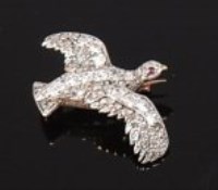 Lot 1258 - A yellow metal diamond set bird brooch, the...