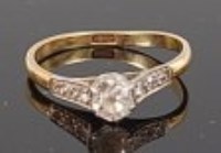 Lot 1295 - An 18ct gold diamond solitaire ring, the claw...