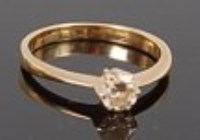 Lot 1296 - An 18ct gold diamond solitaire ring, the claw...