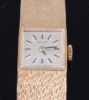 Lot 1300 - A Tissot 9ct gold cased ladies bracelet watch,...