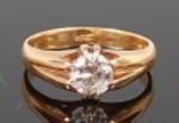 Lot 1308 - An 18ct gold diamond solitaire ring, the claw...