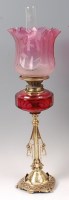 Lot 1353 - A Victorian brass pedestal oil lamp, having a...