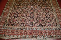 Lot 1549 - A Persian woollen blue ground carpet, the...