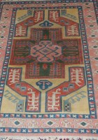 Lot 1551 - A Turkish woollen rug, the yellow ground...