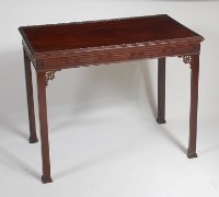 Lot 1566 - An antique mahogany silver table, having a...