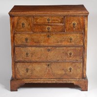 Lot 1573 - A George III oak and walnut chest, the...