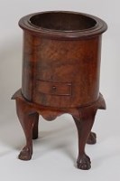 Lot 1591 - A circa 1900 figured walnut wine cooler, of...