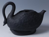 Lot 1144 - An early 19th century black basalt teapot and...
