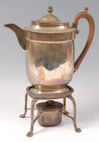 Lot 1193 - A late George III silver hot water jug, having...